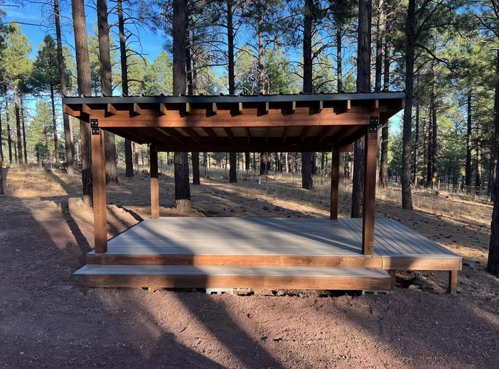 A wooden structure in the middle of a forest