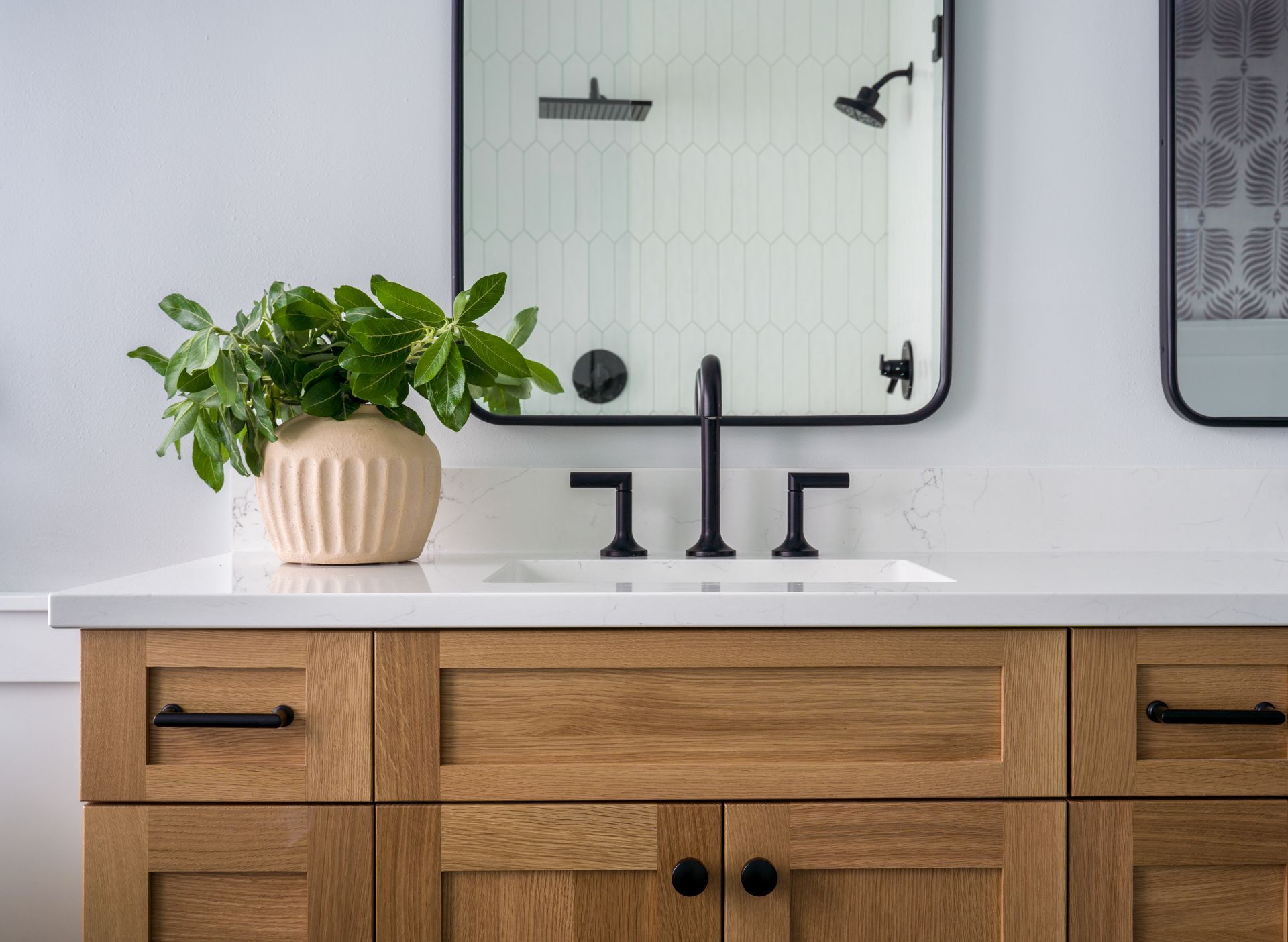 A bathroom with vanity , sink , mirror and potted plant. Allison Myers Design, Emily Barrows Photography, Seattle, WA