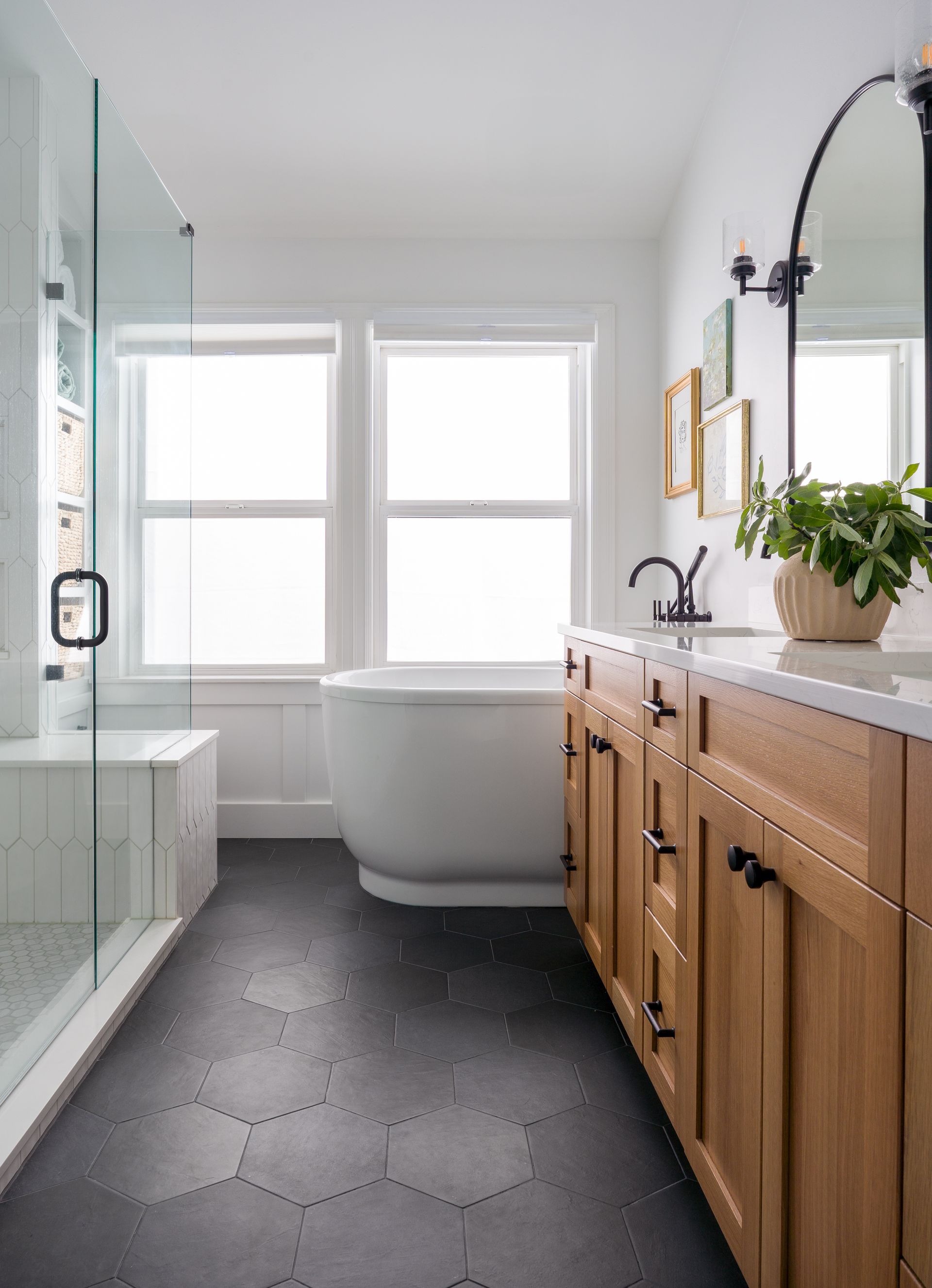 A bathroom with a tub , sink , mirror and shower. Allison Myers Design, Emily Barrows Photography. Seattle, WA.