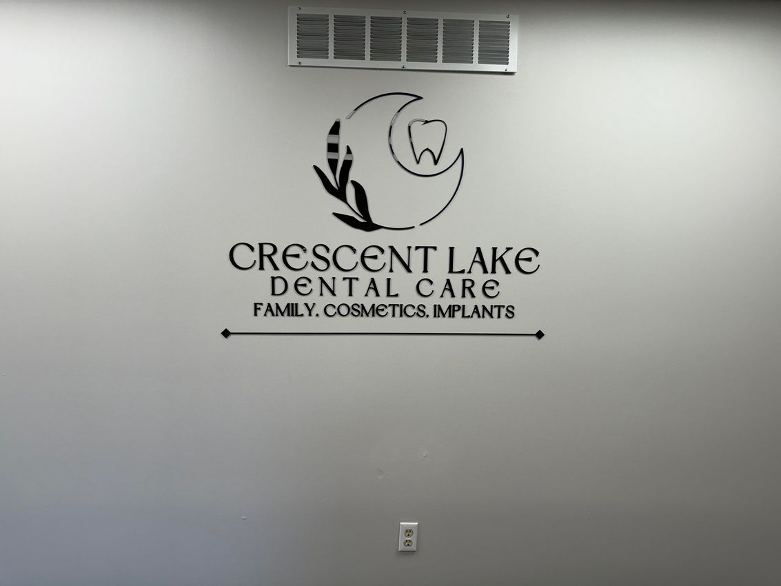 Crescent Lake Dental Care Logo on Wall | Best dentist near Waterford MI for dentures, gum disease, and Invisalign 