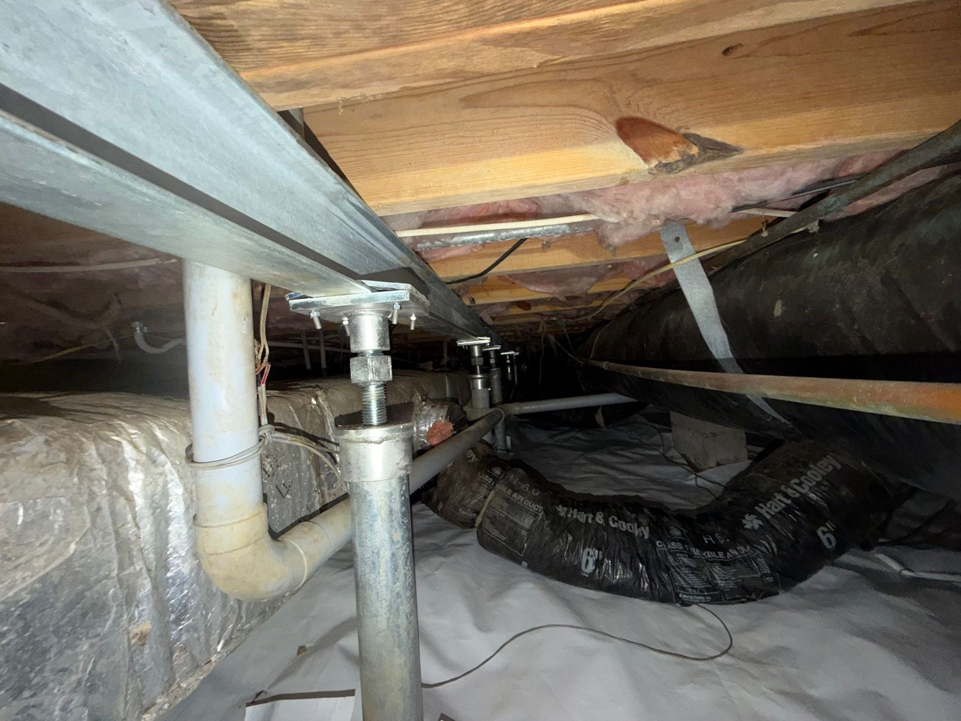 Crawl space jacks and support beam under heavy load bearing wall in Tabb area of Yorktown.