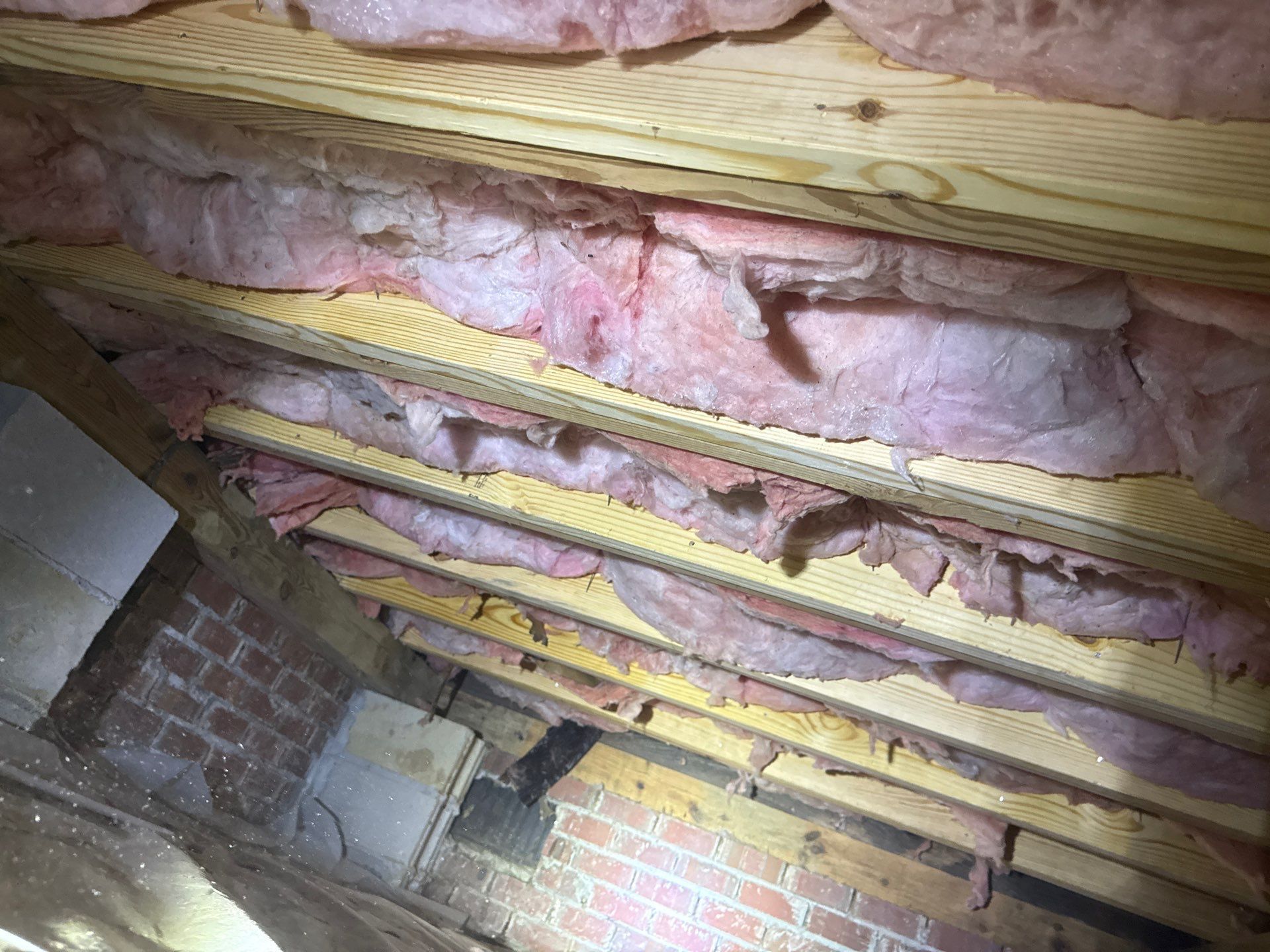 Crawl space floor joists sistered insulation re-installed in Yorktown VA - Yorkshire Downs neighborhood.