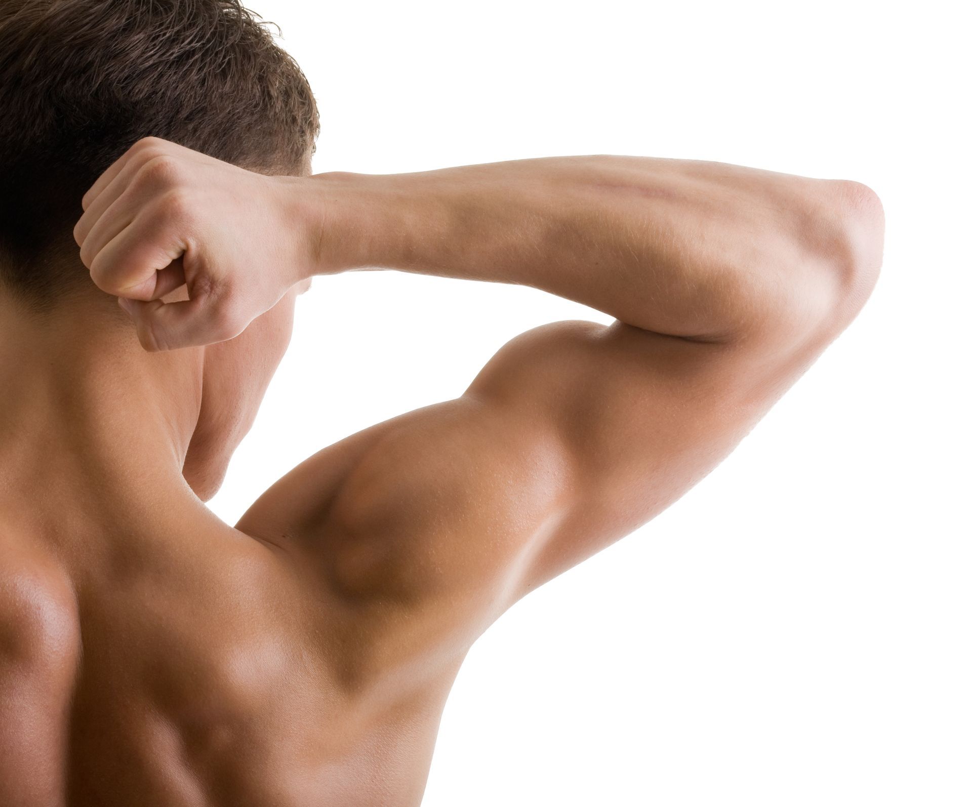 A man without a shirt is flexing his muscles against a white background