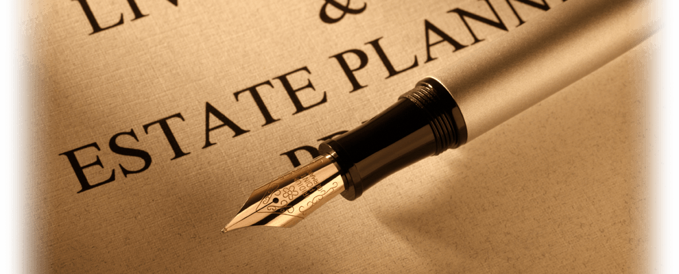 pen hovering over paper that says estate planning