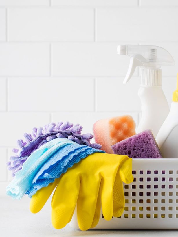 cleaning supplies in a basket