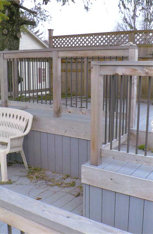 Multi-level composite deck with wood/aluminum railing