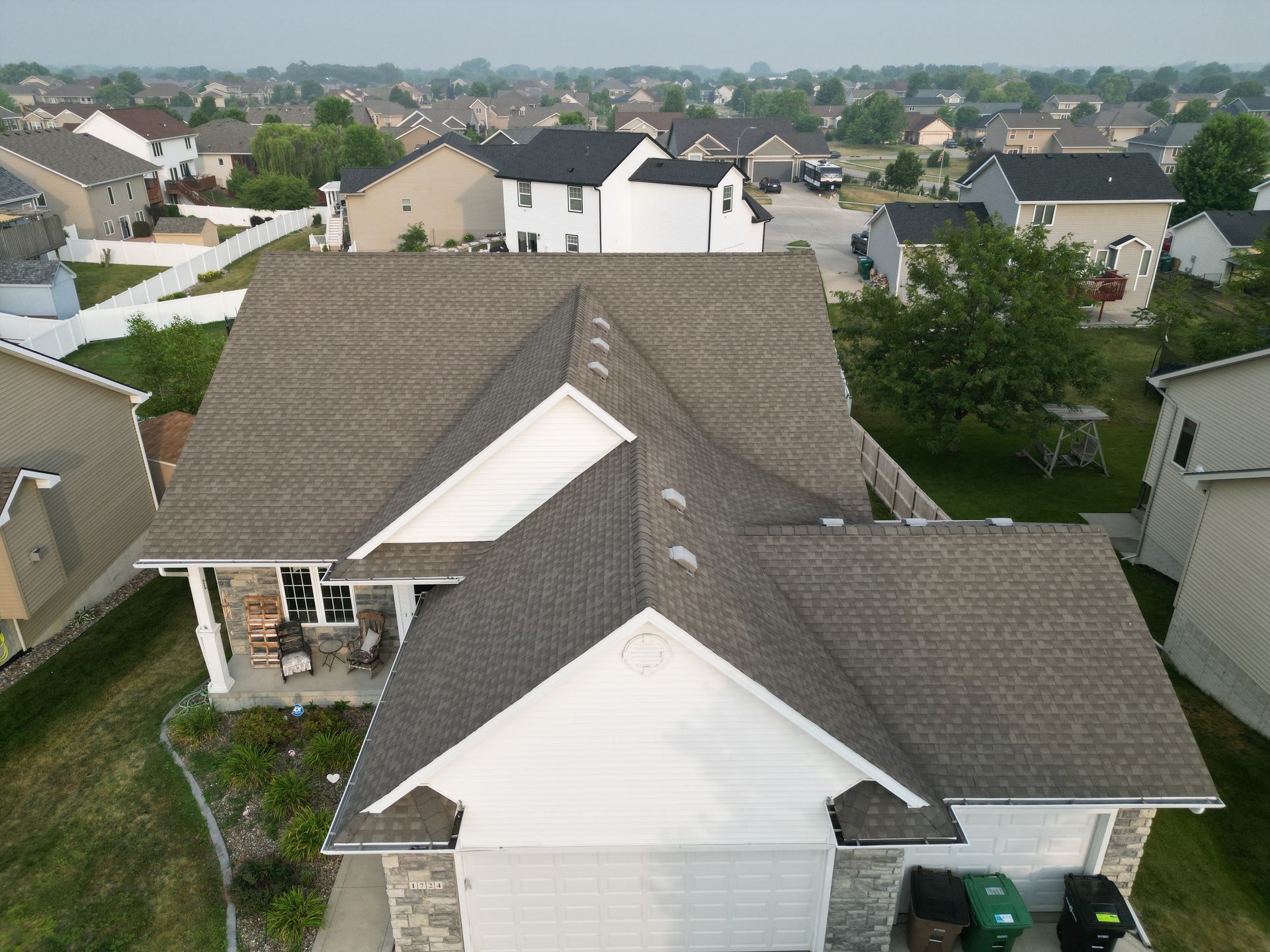 An aerial view of a house in a residential area