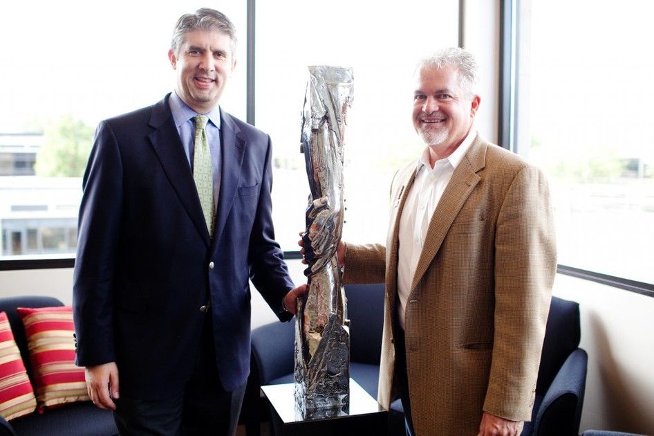 Gary Lee Price posing with UVU President Holland