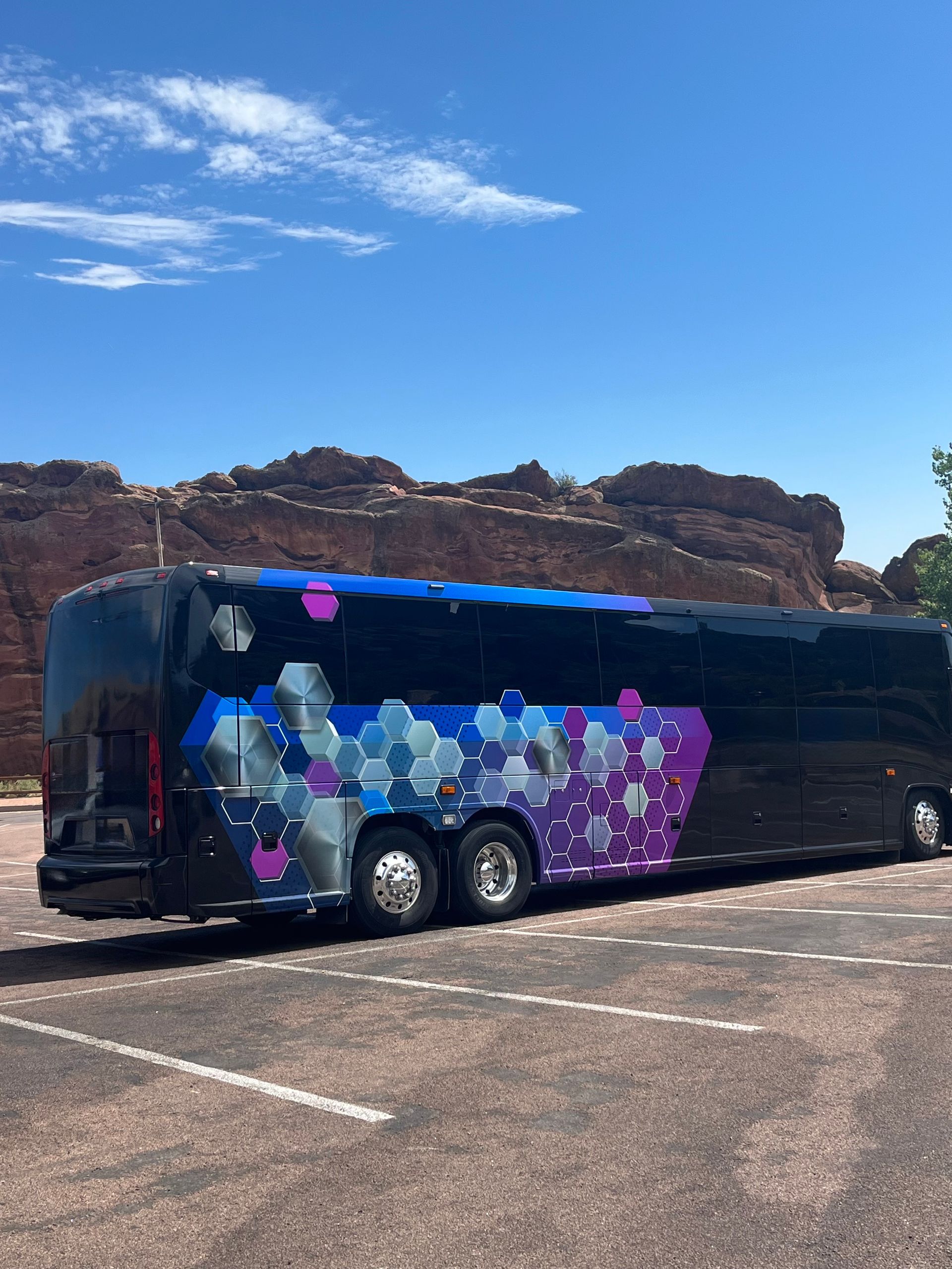Multi-colored motor coach at Red Rocks in Morrison Colorado