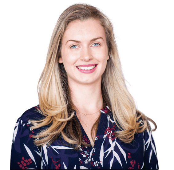 A woman in a floral shirt is smiling for the camera