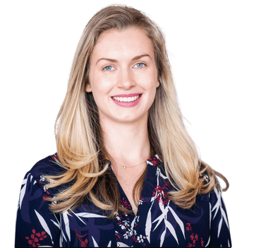 A woman in a floral shirt is smiling for the camera