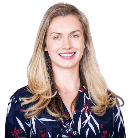 A woman with long dark hair is smiling for the camera