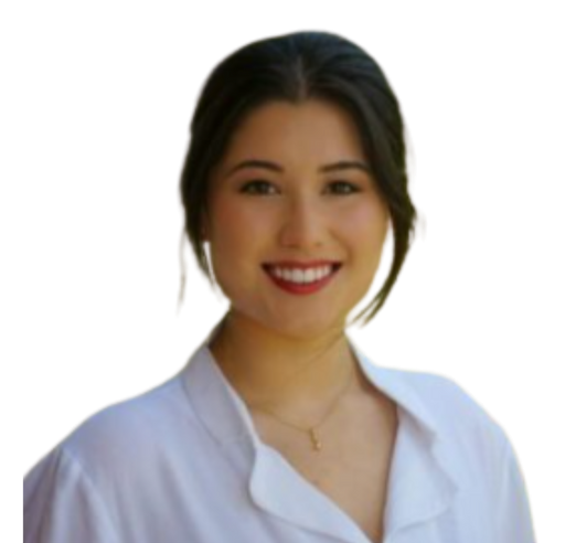 A woman in a white shirt is smiling and wearing a necklace.