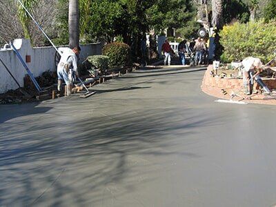 Workers Applying Concretes on Driveways — Paving Service in in Escondido, CA