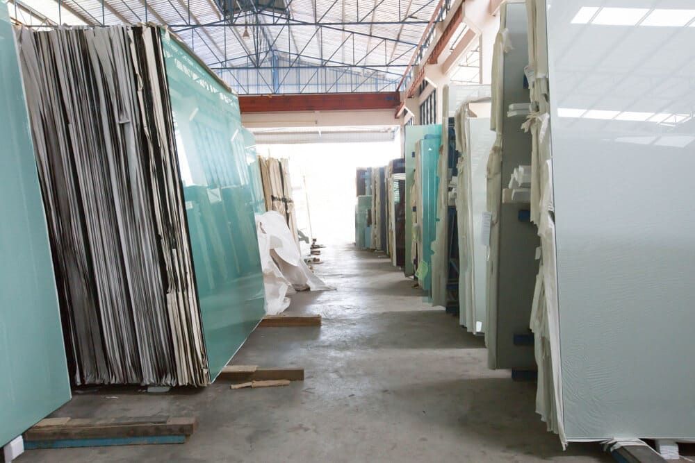 Stacks Of Large Glass Sheets Standing Upright — ACG Windows & Glass in Beaumaris, VIC