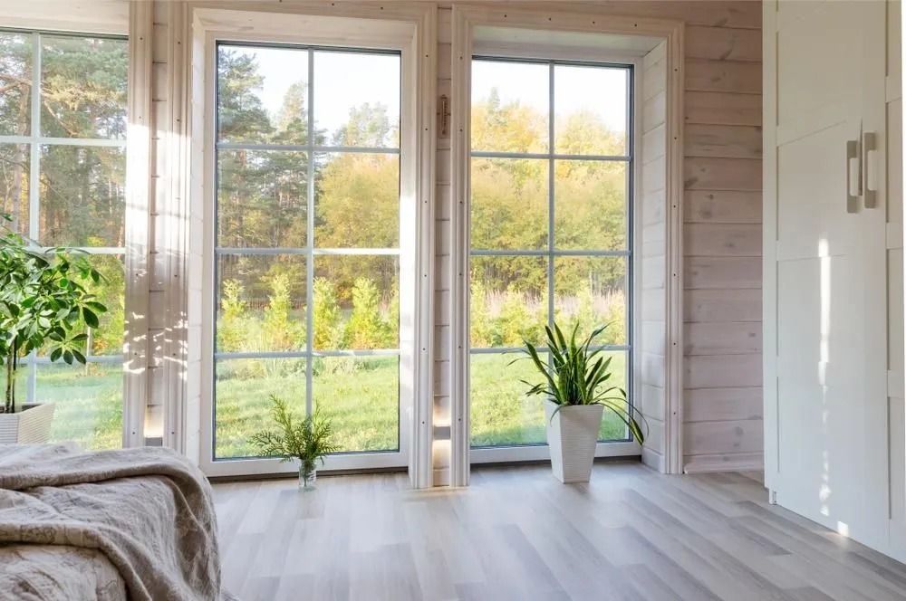 Bright Modern Room With Large Windows, Wooden Walls, Plants — ACG Windows & Glass in Cranbourne, VIC