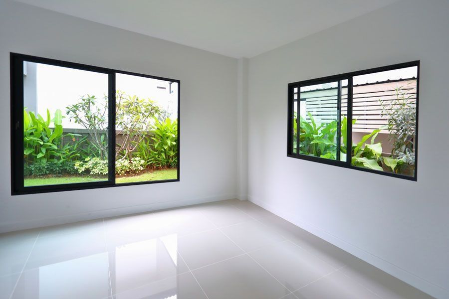 A Modern, Empty Room With White Walls — ACG Windows & Glass in Lyndhurst, VIC