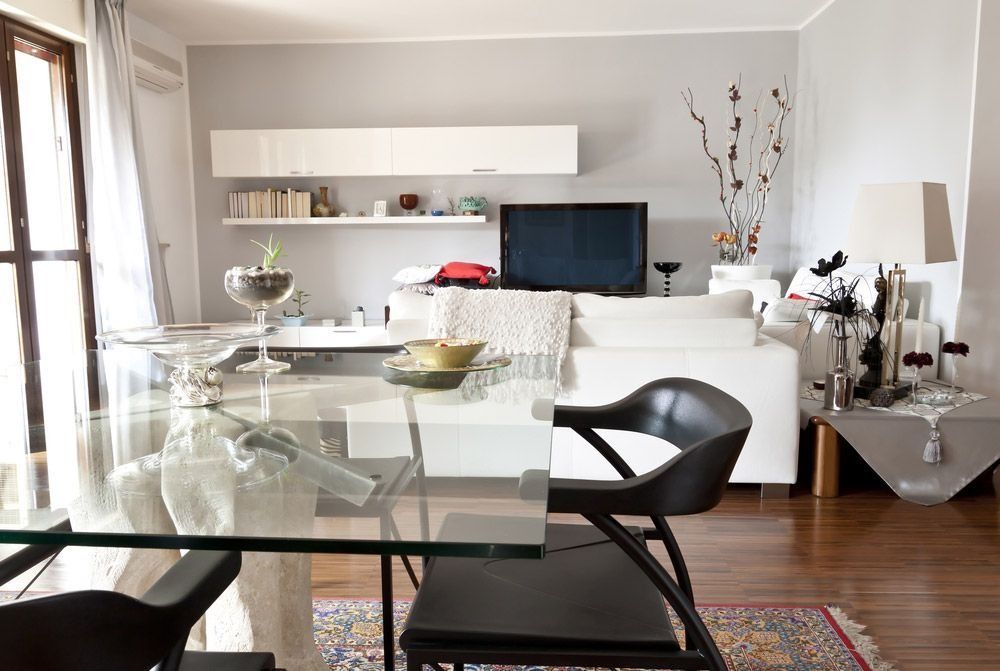 Modern Living Room With a Glass Dining Table — ACG Windows & Glass in Dandenong, VIC