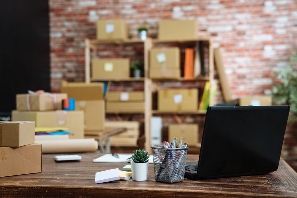 Desk With Laptop, Packages, and Office Supplies — The Move It Man In Cairns, QLD