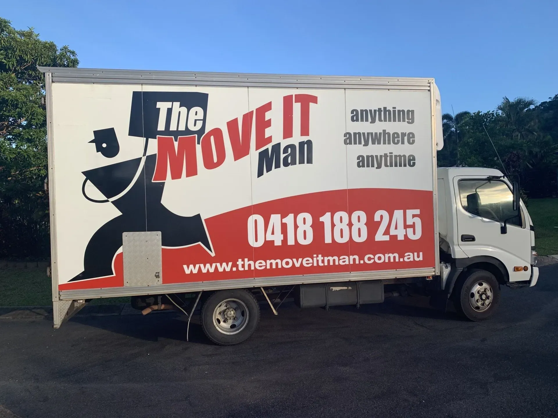 A  Moving Truck Parked in Front of a House — The Move It Man In Bentley Park, QLD