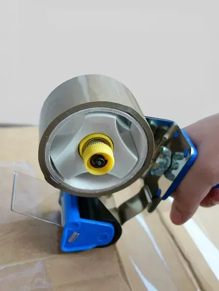 Silver Tape Dispenser With Brown Packing Tape — The Move It Man In Cairns, QLD