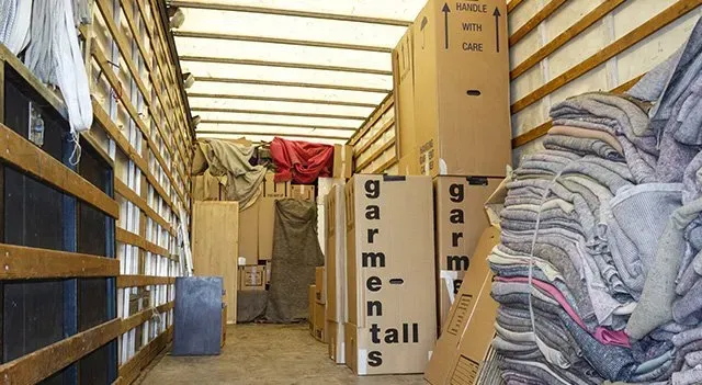 Inside of a Moving Truck, Filled With Boxes, Fabric Bundles, and Furniture  — The Move It Man In Cairns, QLD