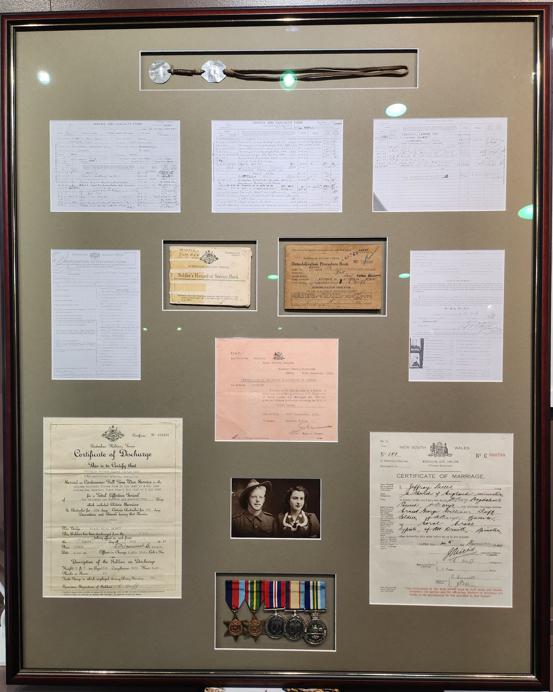 A framed collection of papers including one that says