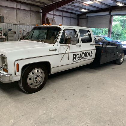 White Chevy dually truck with