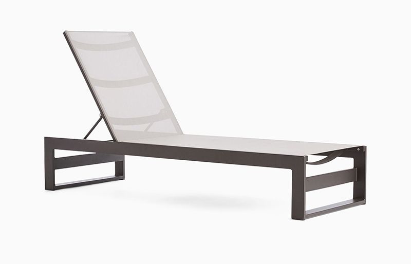 A white lounge chair with a black frame on a white background.