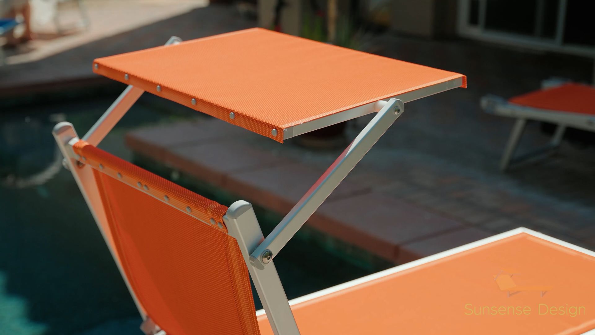 an orange sun bed with an articulating sun visor