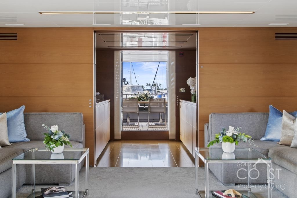 A living room with a couch and two tables