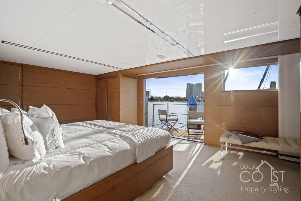 A bedroom with two beds and a sign that says coast