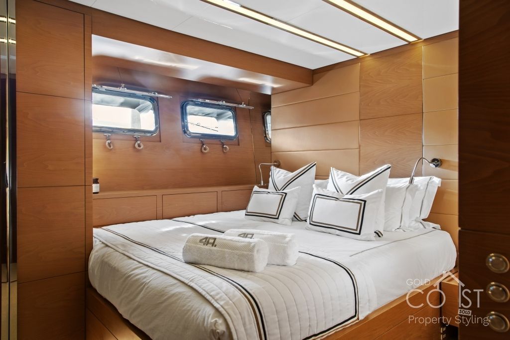 A bedroom on a boat with a large bed