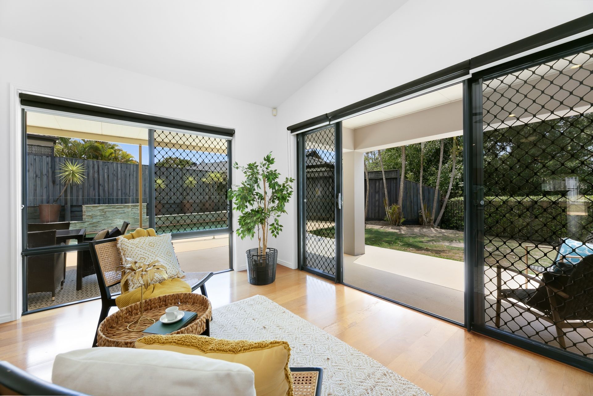 A living room with sliding glass doors leading to a patio.