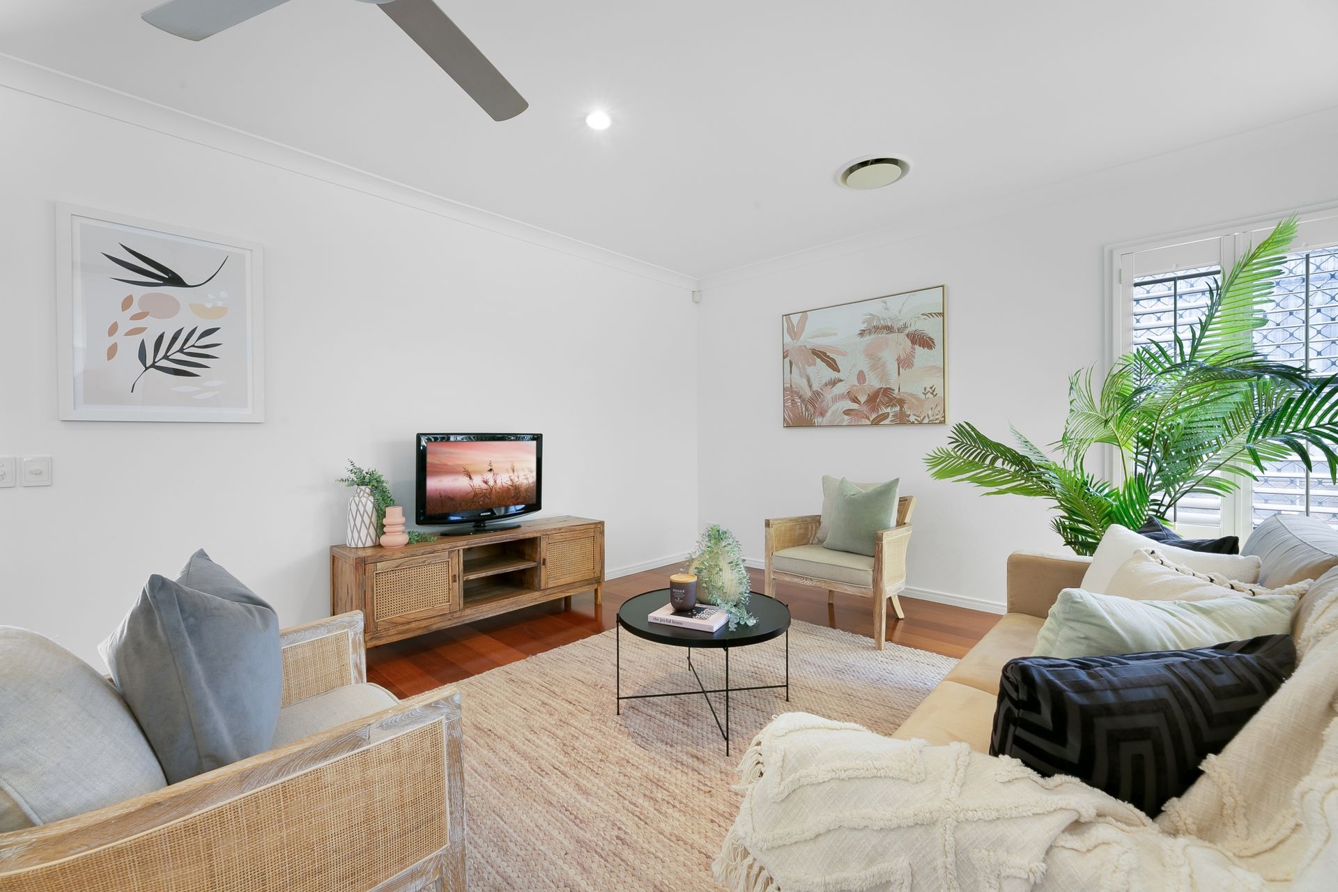 A living room filled with furniture and a flat screen tv.