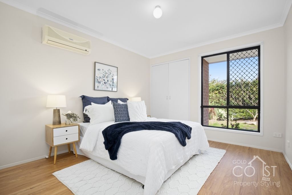 A bedroom with a large bed and a window in Labrador