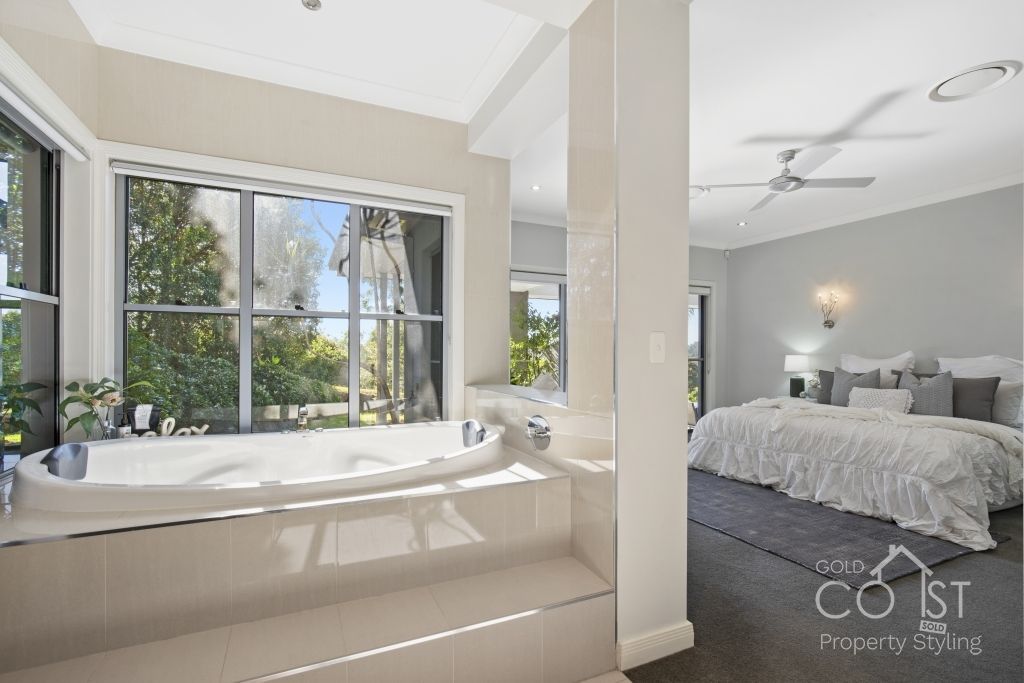 There is a large bathtub in the middle of the room.