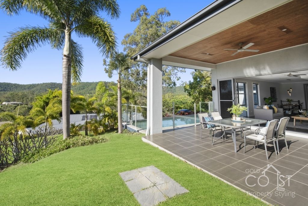 A large house with a patio and a swimming pool