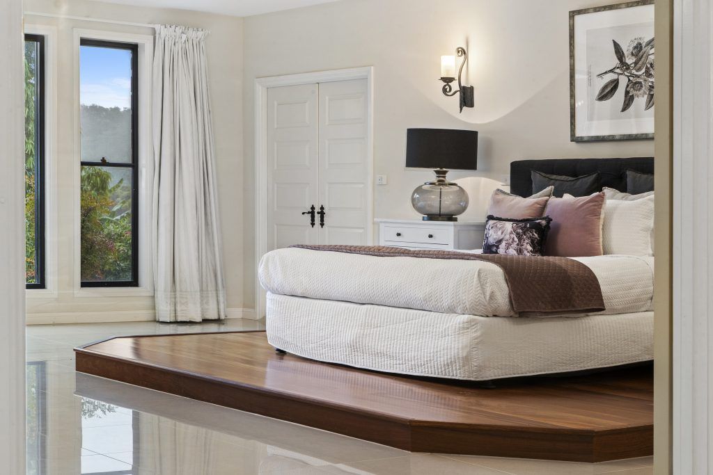 There is a large bed in the middle of the room.