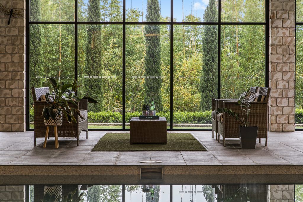 There is a large swimming pool in the middle of the room.