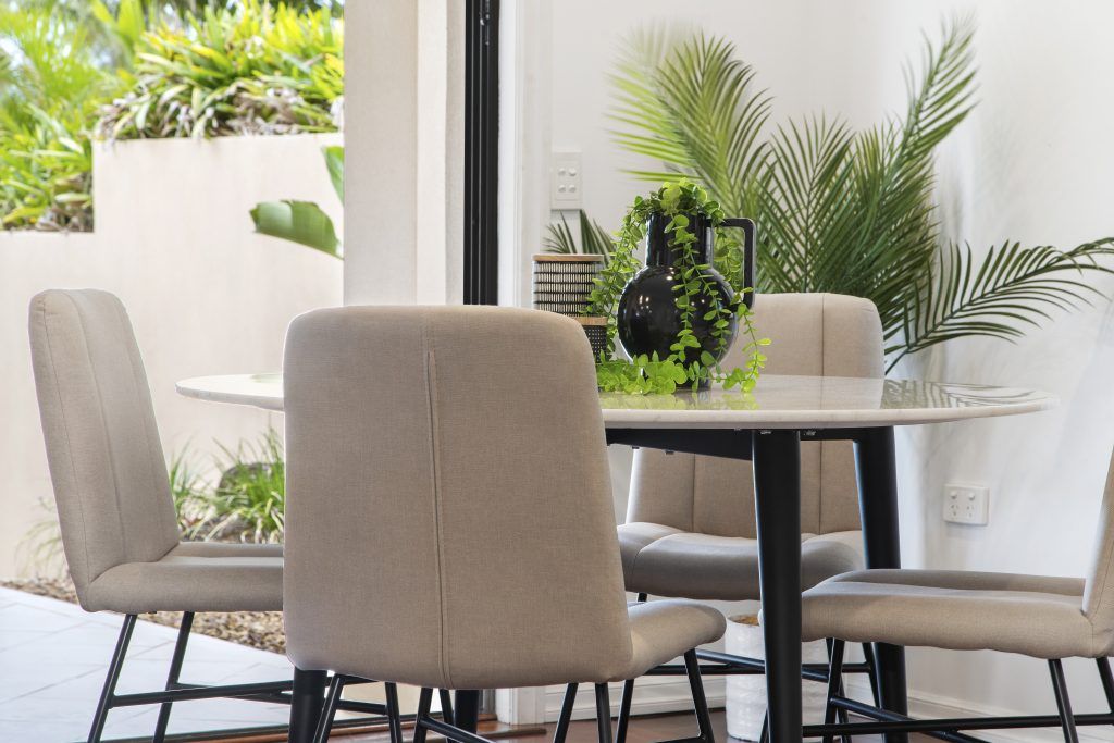 There is a table and chairs in the dining room.