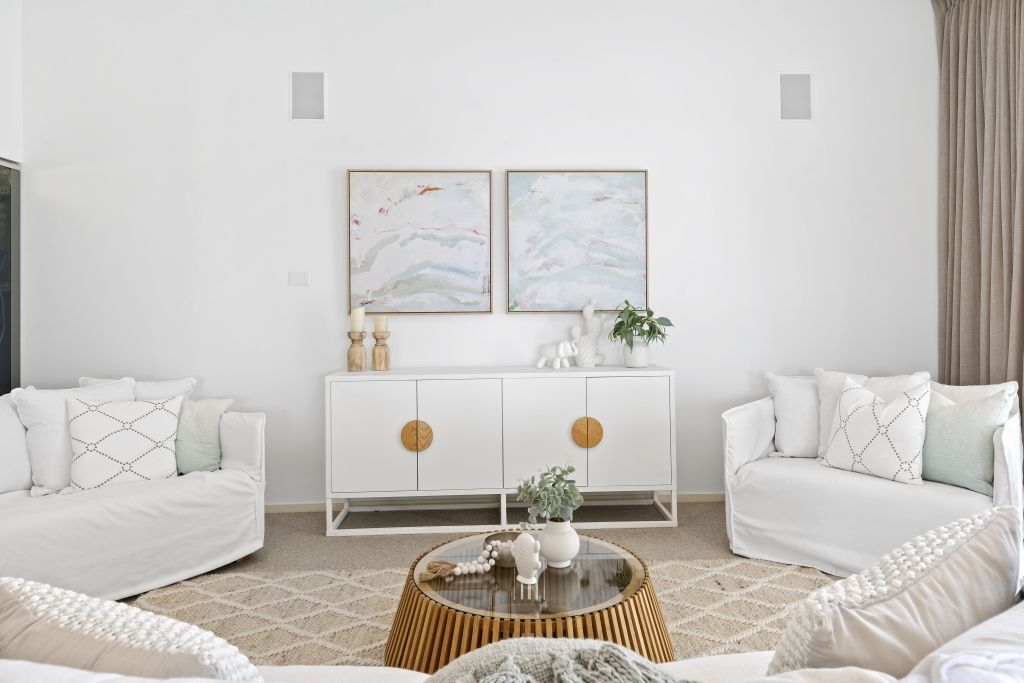 A living room filled with furniture and a coffee table.