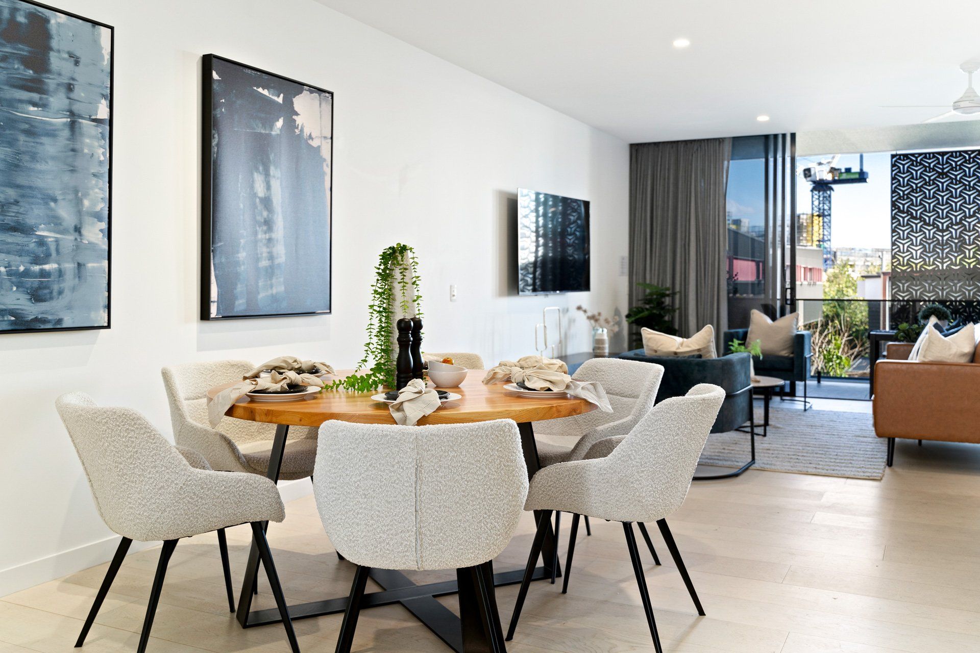 A living room with a dining table and chairs