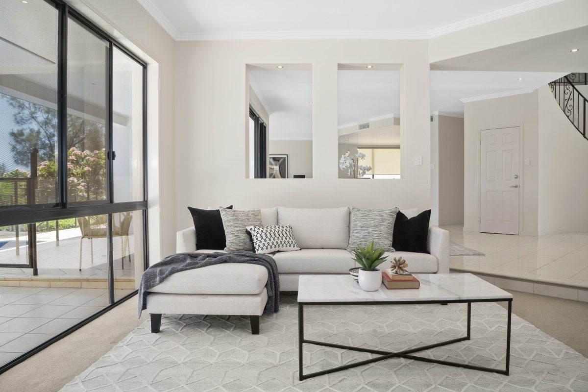 A living room with a couch and a coffee table