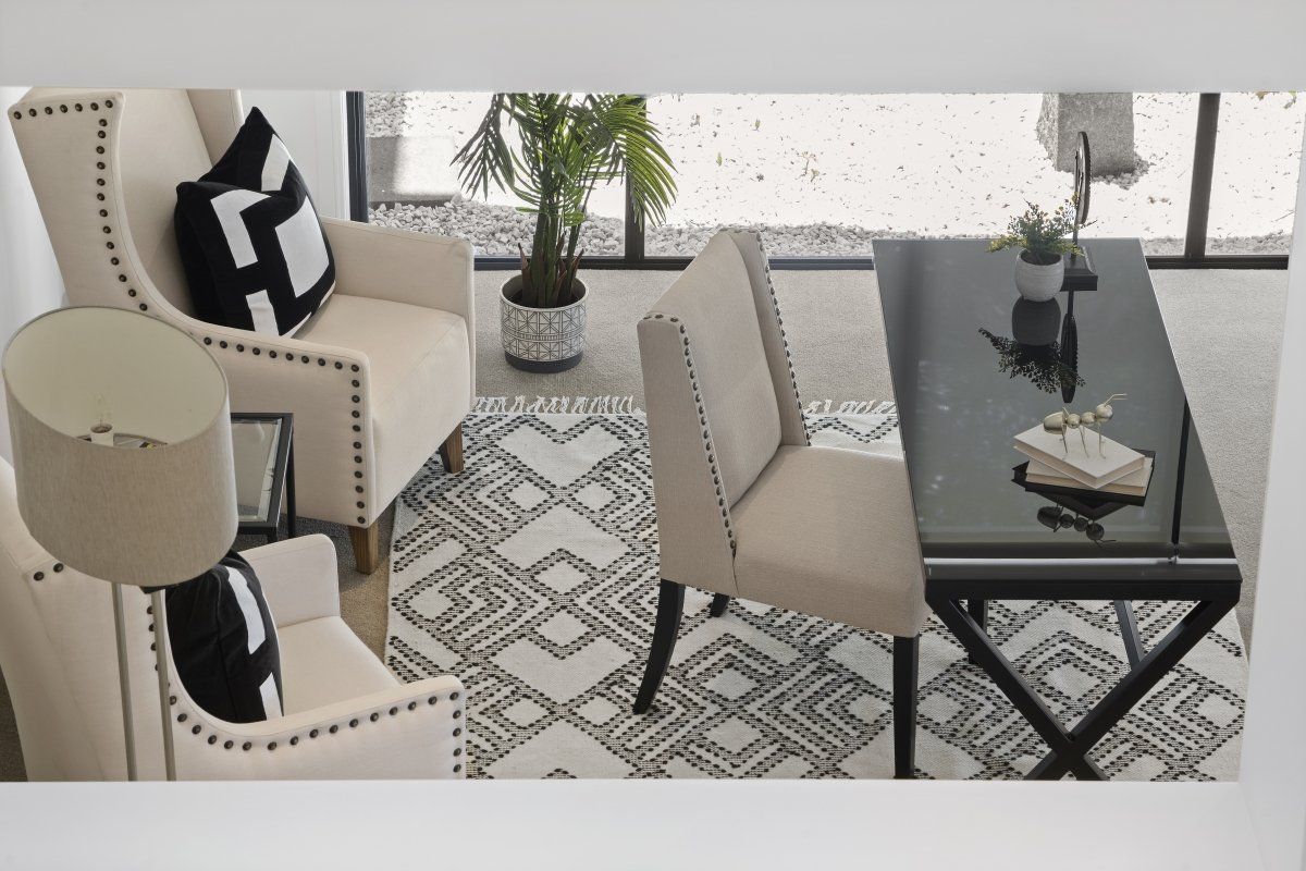 A living room with two chairs and a coffee table