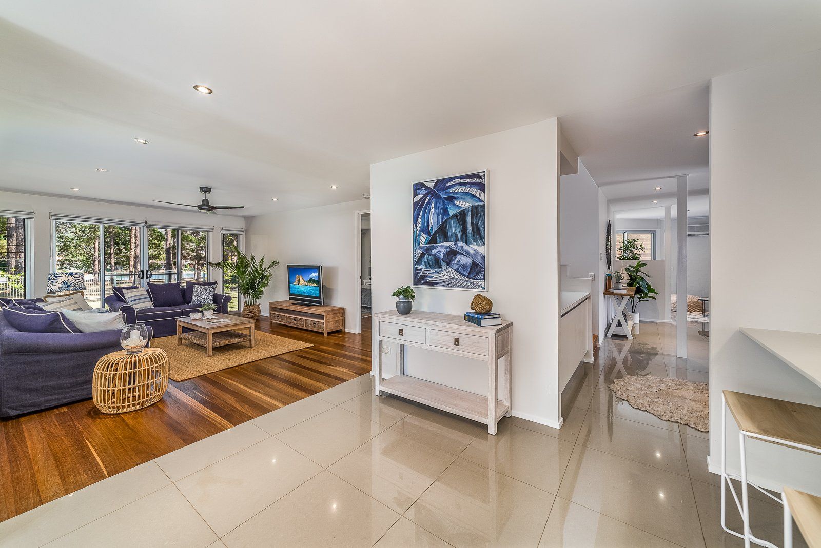 A living room filled with furniture and a television.