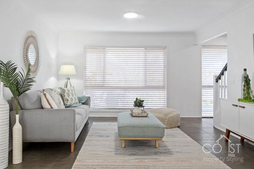 A living room with a couch and a coffee table