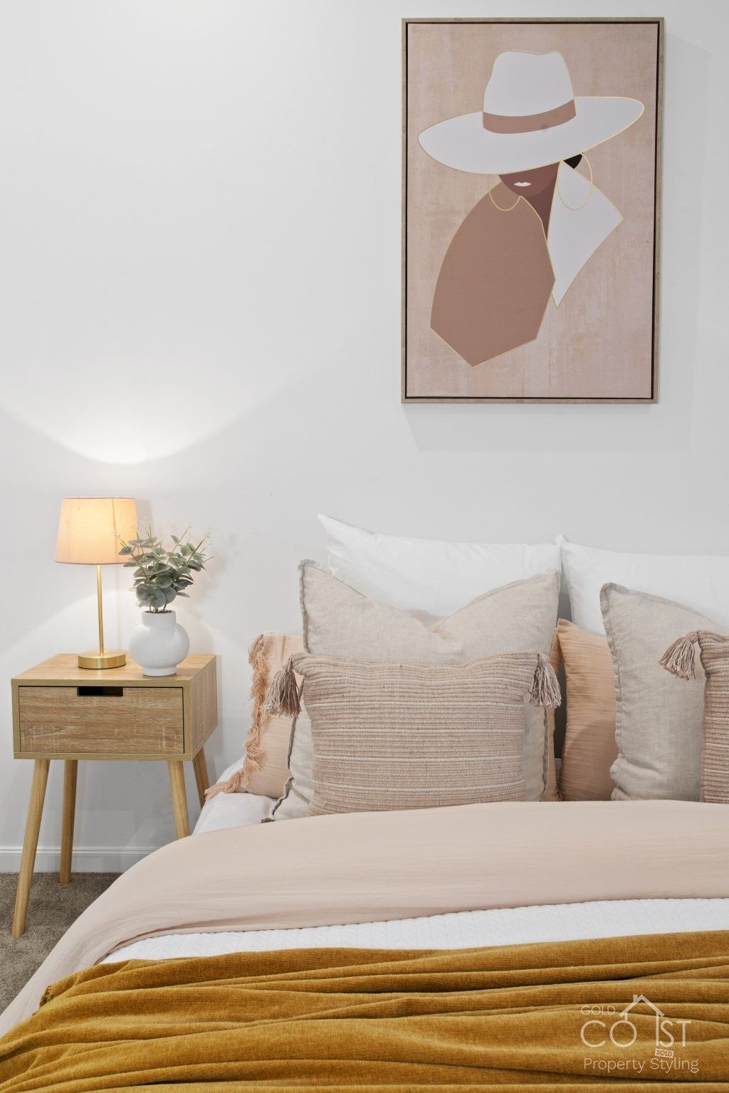 contempary bed staging with artwork