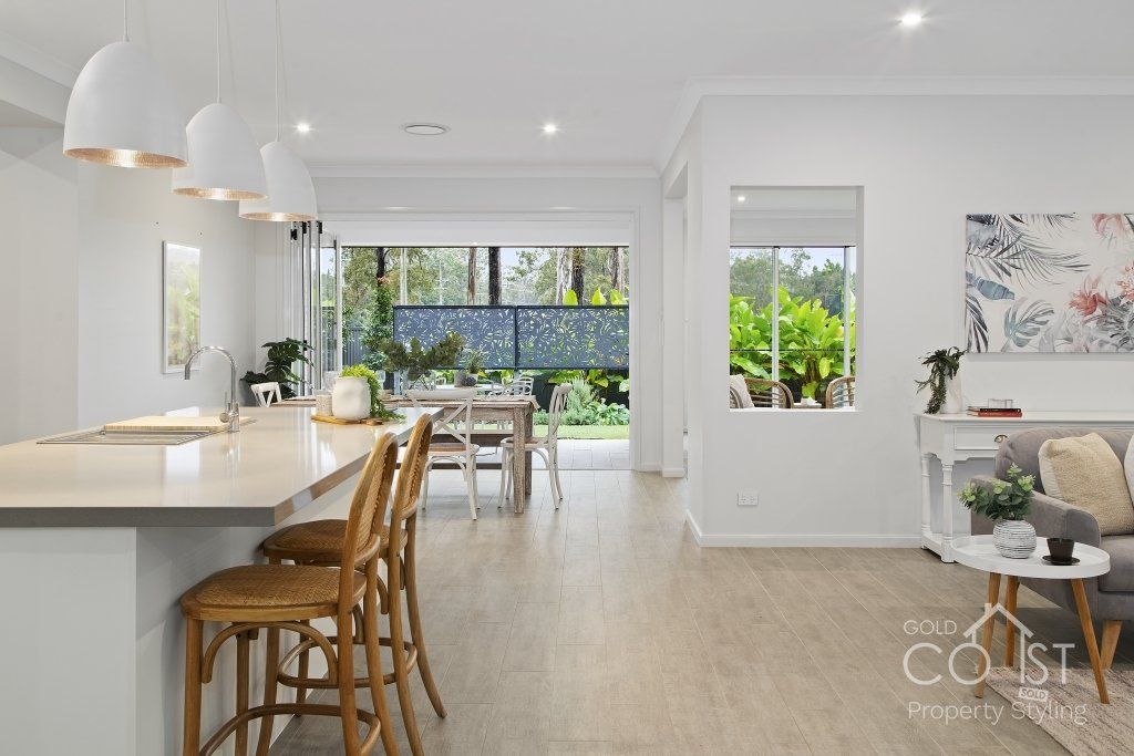 A kitchen , dining room and living room in a house.