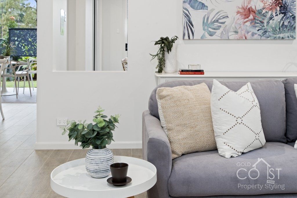 A living room with a couch and a coffee table